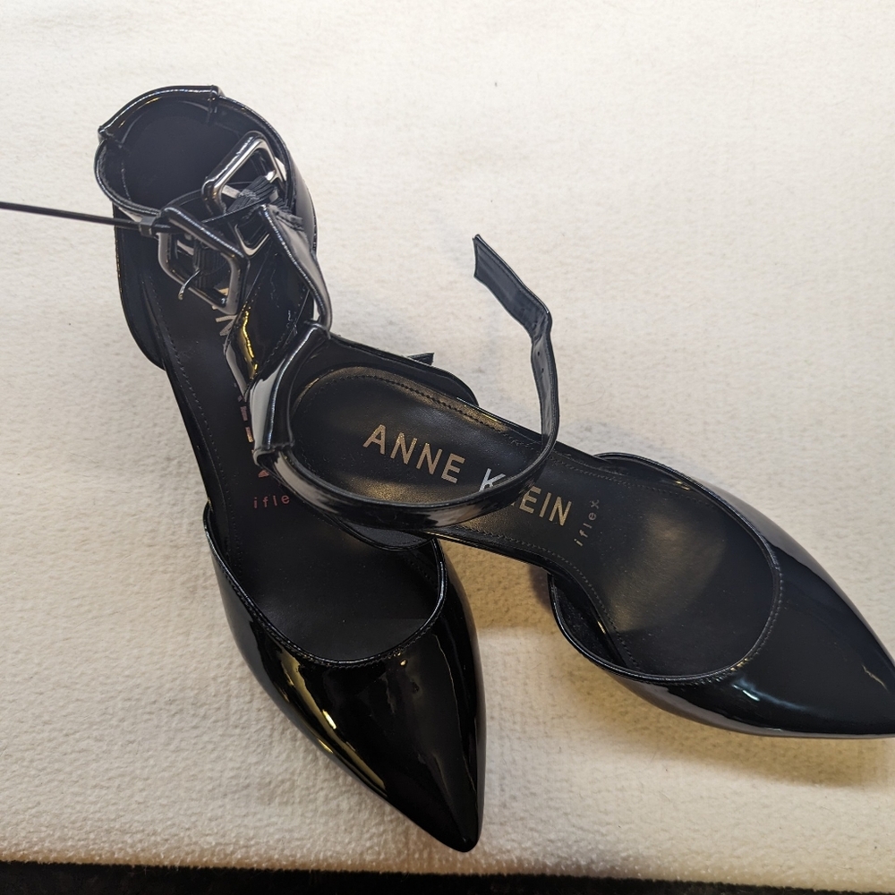 Anne Klein black patent high heels with ankle strap.
